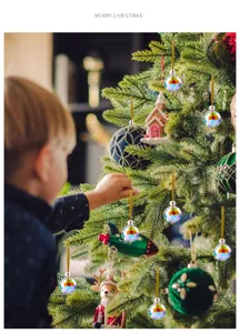 Close-up of faceted rainbow crystal ornaments hanging on a decorated Christmas tree.