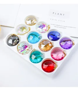 Close-up of 30mm multi-colored faceted crystal glass prisms for Christmas tree decor