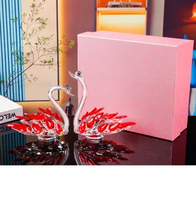 Elegant pair of red and clear crystal swan figurines with a pink gift box for home decor