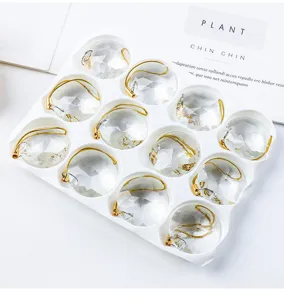 Close-up of 12pcs 30mm crystal prism ornaments in a white tray for Christmas decor