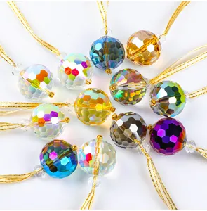 Faceted crystal Christmas tree ball ornaments in multiple colors with gold hanging strings