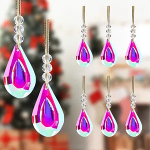 Macro detail of iridescent teardrop Christmas tree ornaments with colorful AB coating finish
