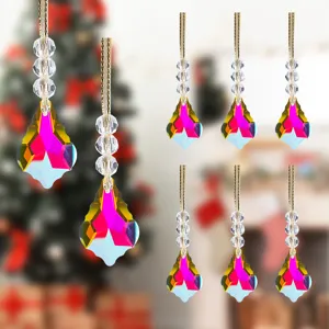 Detail view of colorful crystal Christmas tree ornaments with faceted teardrop pendants.