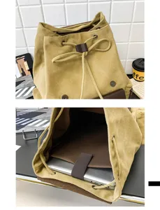 Detalle de mochila de lona vintage con cierre de cordón y compartimento para portátil
