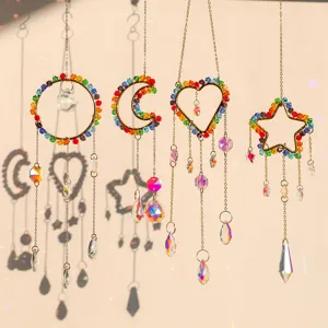 Detailed close-up of crystal suncatchers with colorful beads in heart and moon shapes