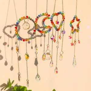 Detail view of colorful heart moon and star suncatchers creating rainbows and shadows.