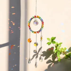Detail shot of rainbow crystal suncatcher pendant with colorful light refraction effects
