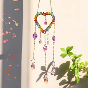 Rainbow crystal heart sun catcher detail with vibrant colorful AB prism drops in sunlight