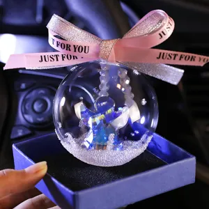 Sparkling crystal ball car hanging ornament featuring a faceted angel and snow filler