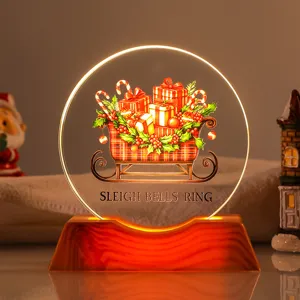 Close-up detail of warm glow Christmas sleigh bells ring crystal night light ornament