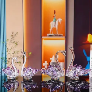 Set of crystal swan figurines with purple accents for home and car decor