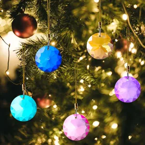 Set of multicolor 30mm faceted crystal suncatcher prisms hanging on a Christmas tree