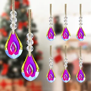 Vibrant iridescent teardrop crystal Christmas ornaments hanging in a decorative festive group