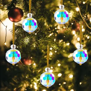 Colorful faceted crystal ball Christmas tree ornaments with iridescent finish hanging on branches