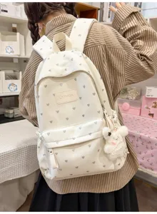 Casual white backpack with heart pattern and cute rabbit plush pendant detail