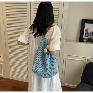 Stylish light blue hollow knit mesh shoulder bag with brown leather strap for summer