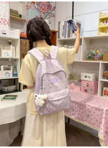 Lightweight purple heart pattern backpack with plush charm, casual school bag for girls.