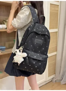 Stylish black backpack with silver heart pattern and cute plush bunny keychain detail