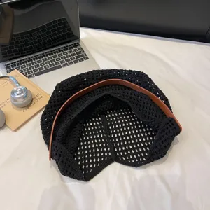 Fashionable black hollow knit crochet shoulder bag with brown strap for summer travel