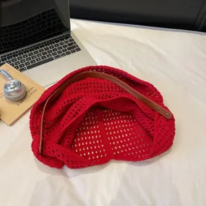 Red crochet hollow-out net tote bag with brown leather shoulder strap