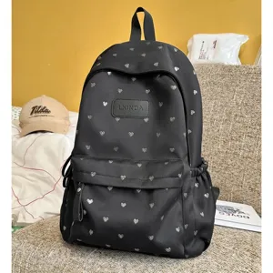 Lightweight black casual school backpack with silver heart pattern and LXINDA logo.