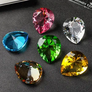 Detailed macro view of colorful pear-shaped faceted crystal diamond gemstone ornaments