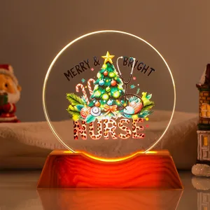 Close-up of a festive Christmas nurse-themed LED night light with glowing wooden base.