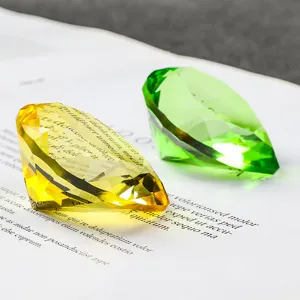 Close-up of yellow and green crystal diamonds on an open book page