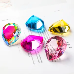 Detailed close-up showing heart-shaped crystal diamonds in various vibrant colors on white background