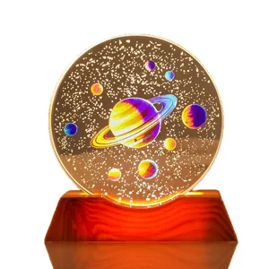 Decorative luminous crystal ball night light featuring colorful planetary patterns on a wooden base
