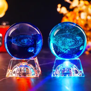 Close-up detail of 3D laser engraved solar system and galaxy crystal ball night lights