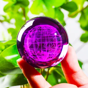 Detailed macro shot of 3D laser engraved purple crystal ball globe ornament