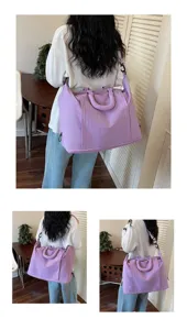 Lavender large capacity travel bag with adjustable strap shown from back on model