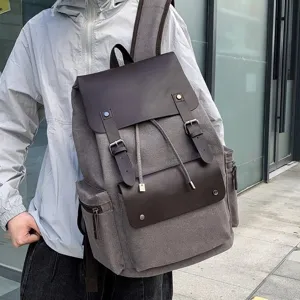 Mochila de lona vintage de gran capacidad con cordón y solapa de cuero para viajes.