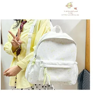 Mochila escolar blanca de estilo coreano con estampado de lazos amarillos y gran capacidad