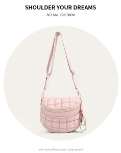 Close-up of pink quilted puffer crossbody bag with stylish dual zipper compartments.