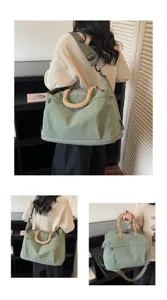 Large capacity green travel duffel bag with embroidered bow details