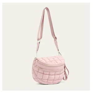 Detailed view of pink quilted bubble shoulder bag featuring dual zipper design and wide strap