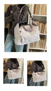 Stylish large capacity travel bag with embroidery details and adjustable shoulder strap