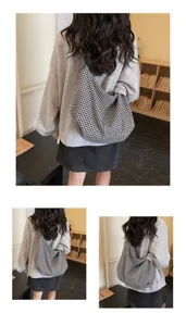 Back view detail of a stylish black and white gingham nylon tote bag on a model shoulder