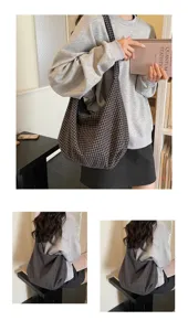 Lifestyle detail of a large checked nylon tote bag worn on shoulder in a casual setting