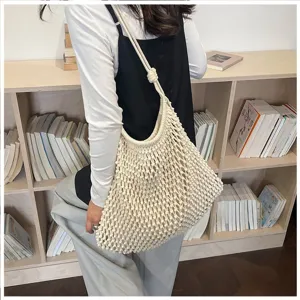 Sac cabas minimaliste en macramé crème tissé à la main pour les vacances d'été à la plage