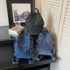 Vintage denim drawstring backpack in three blue washes for students and travel