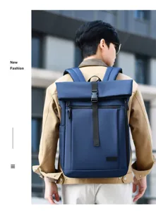 Modern waterproof blue roll-top laptop backpack for men, ideal for business travel use