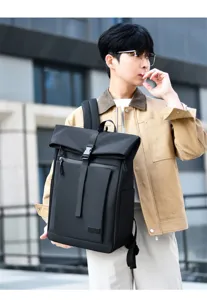 Black waterproof business casual backpack for men shown in an urban street setting