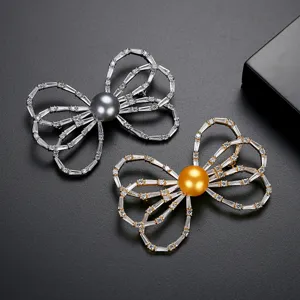 Elegant bow-knot brooches with shiny gray and golden shell pearls for formal suits