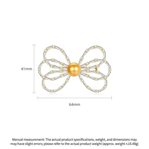 Elegant gold-plated bow brooch featuring a golden shell pearl and clear zircon stones