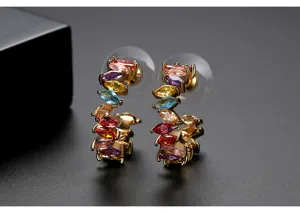 Detail view of gold-plated C-shaped earrings with colorful marquise zircons