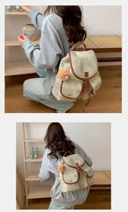 Detailed view of this vintage canvas backpack for women, showing stylish leather trim.