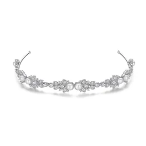 Elegant silver bridal headband with pearls and micro-inlaid cubic zirconia crystals.